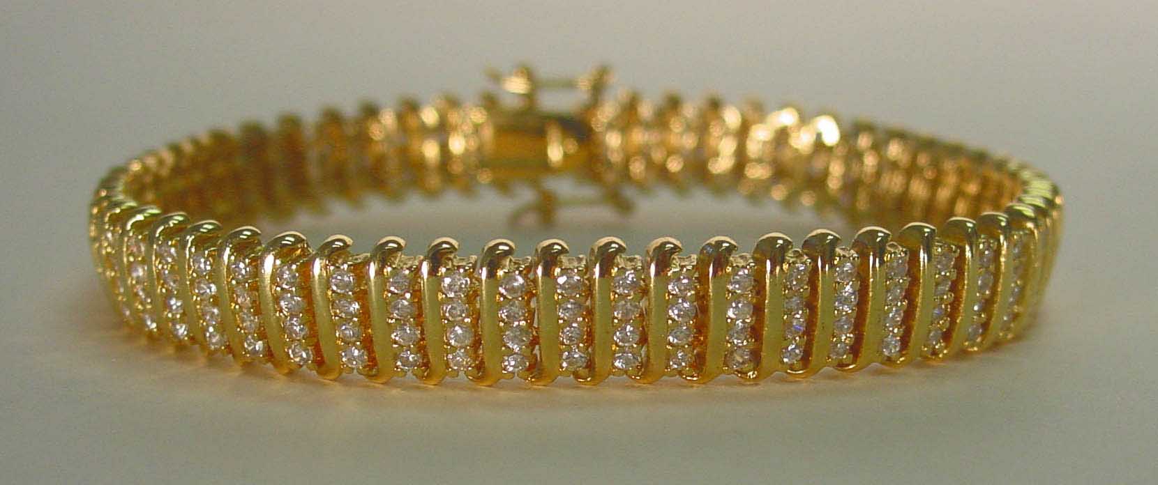 Clear colored CZ 4 row gold bracelet