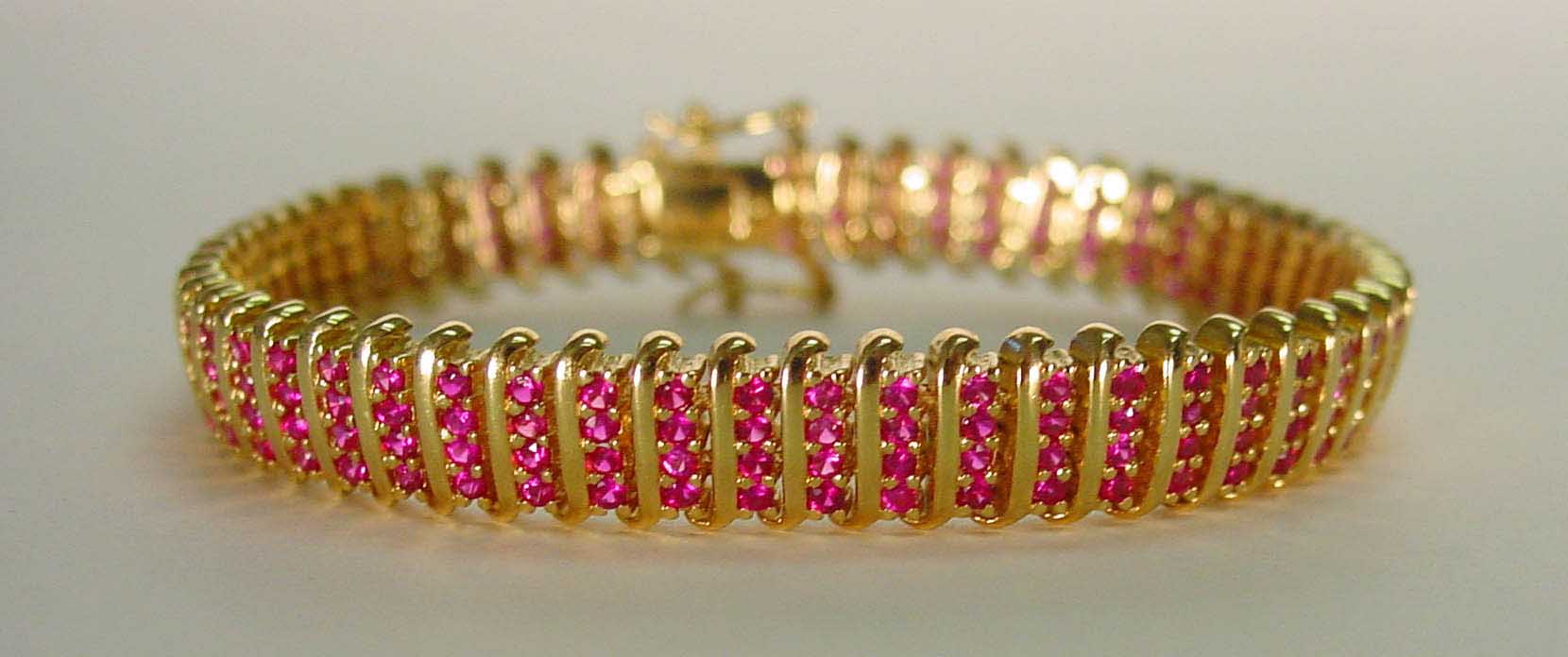 Ruby colored CZ 4 row gold bracelet