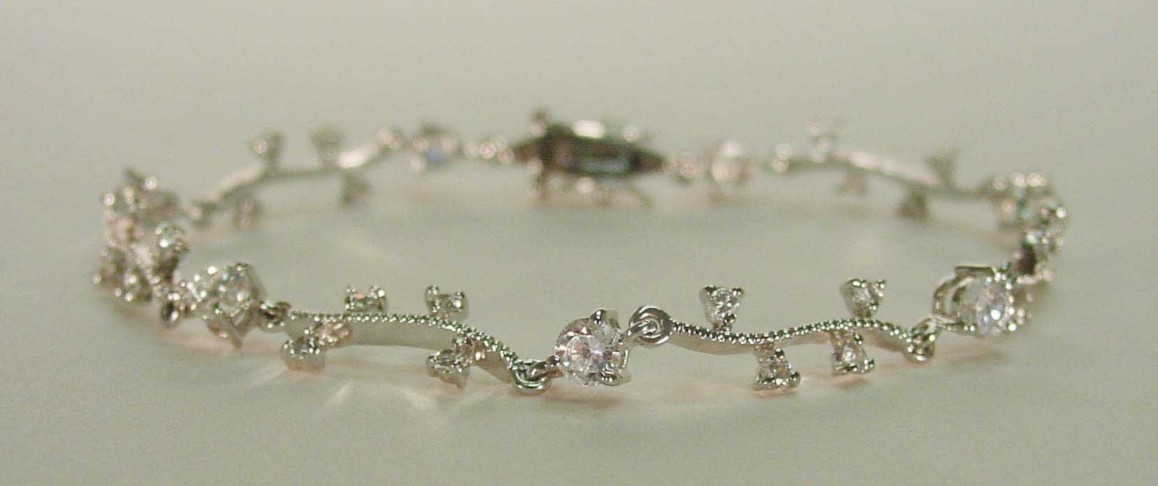 Clear crystal diamond cut wave silver bracelet